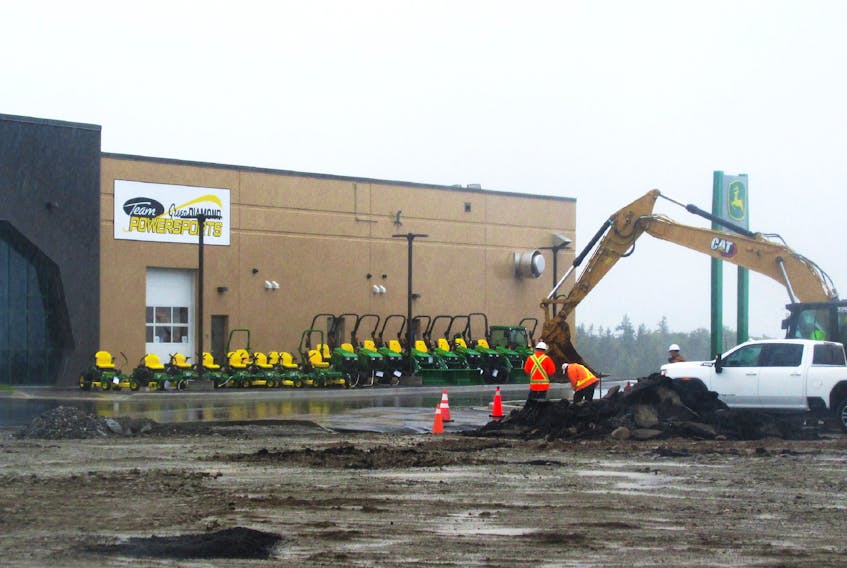 Work continues on the roadway near Team Green Diamond Powersports Sydney, the first retail store set to open at Seventh Exchange in Membertou. The local John Deere tractor dealer will be closing its Reeves Street store and moving to the Membertou development which will later include a gas station and a shopping district. The new 13,000-square-foot building will be the only Green Diamond equipment location in Cape Breton and the seventh in the province. A soft opening will take place on Sept. 26. IAN NATHANSON/CAPE BRETON POST
