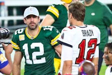 Oct 18, 2020; Tampa, Florida, USA; Tampa Bay Buccaneers quarterback Tom Brady (right) greets Green Bay Packers quarterback Aaron Rodgers (left) after a NFL game at Raymond James Stadium. 