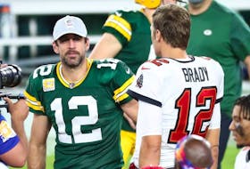Oct 18, 2020; Tampa, Florida, USA; Tampa Bay Buccaneers quarterback Tom Brady (right) greets Green Bay Packers quarterback Aaron Rodgers (left) after a NFL game at Raymond James Stadium. 