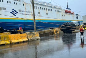 Stevedores in Port aux Basques secure the MV Leif Ericson to the dock in advance of Hurricane Fiona. – Photo Courtesy of Marine Atlantic