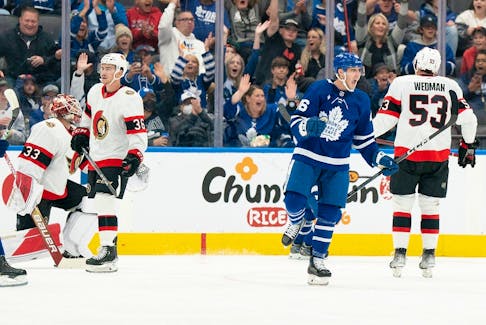 Alex Steeves of the Leafs celebrates after scoring a goal against the Senators during the second period of Saturday afternoon's NHL pre-season matchup.
