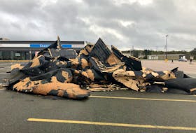 A pile of debris in the parking lot near Fabricville in Sydney on Saturday evening appears to be from a roof. NICOLE SULLIVAN / CAPE BRETON POST