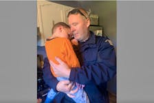 Grady MacKinnon gets a hug from one of the RCMP officers who had responded to the call of a missing child. The officer, like other searchers was happy to see the boy safe.