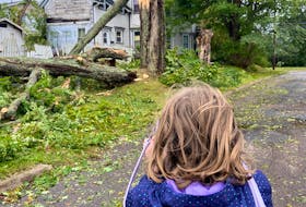 Eight-year-old Niamh Boyle taking photos of the damage caused by Fiona in Truro, N.S. -Contributed