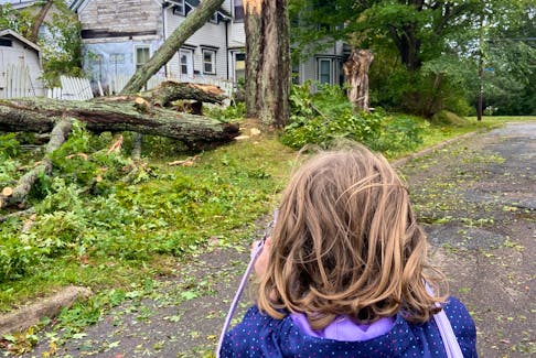 Eight-year-old Niamh Boyle taking photos of the damage caused by Fiona in Truro, N.S. -Contributed