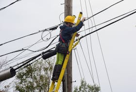 A cable technician works to restore internet to a part of Charlottetown on Sept. 26. Communication has been a problem since Fiona hit P.E.I. CONTRIBUTED