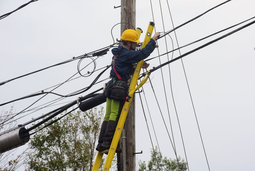 A cable technician works to restore internet to a part of Charlottetown on Sept. 26. Communication has been a problem since Fiona hit P.E.I. CONTRIBUTED