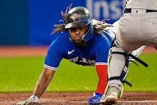 Blue Jays first baseman Vladimir Guerrero Jr. slides into home plate against the New York Yankees at Rogers Centre. 