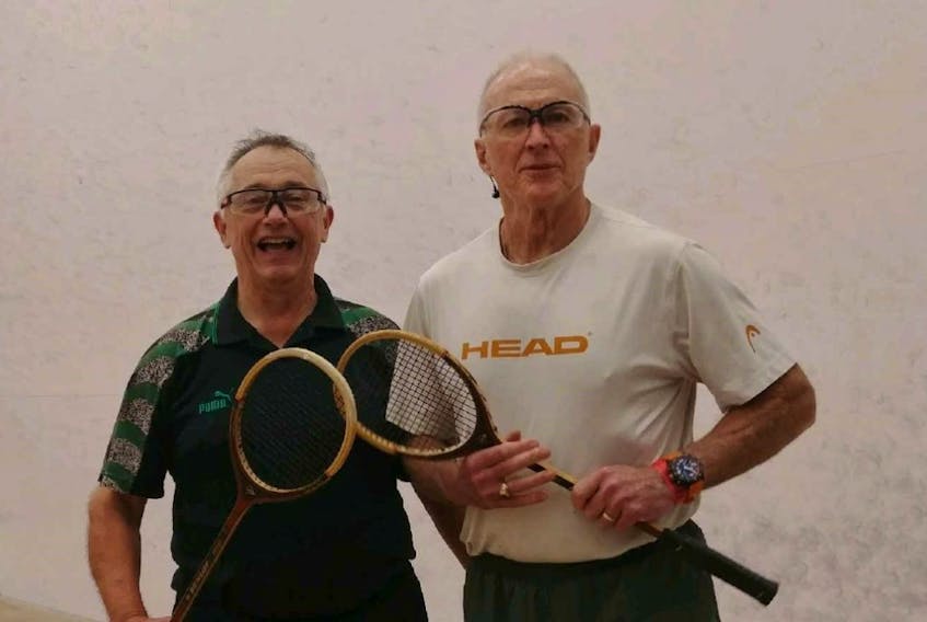 Jeff Driscoll (left) and Paul Martin, shown here at the Memorial University squash courts, first started playing squash together in September 1972. This month marks their 50th year playing together.
