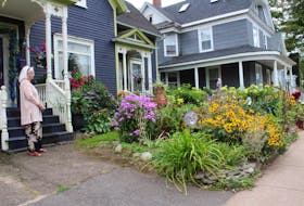Gourley's front yard is home to many colourful flowers and hand-crafted décor.