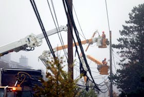 September 27, 2022--Nova Scotia Power crews work on installing new poles and lines along Highfield Park Drive in Dartmouth after several power poles were brought down during Hurricane Fiona.
ERIC WYNNE/Chronicle Herald