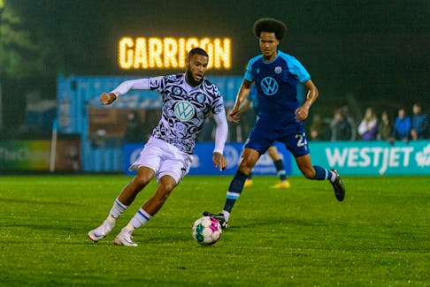 HFX Wanderers midfielder Mo Omar (right) defends against Pacific FC during Canadian Premier League action Tuesday night at the Wanderers Grounds. - TREVOR MacMILLAN / HFX WANDERERS