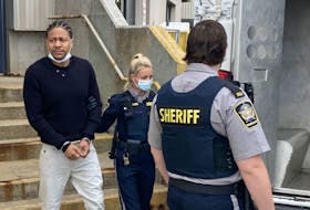 Tyreece Alexander Whynder-Ewing is escorted to a sheriff's van Wednesday after appearing in Dartmouth provincial court for a preliminary inquiry on a charge of second-degree murder.