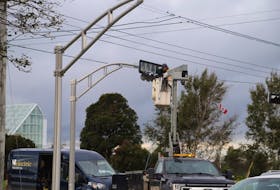 A Hansen Electric worker fixes a set of traffic lights at the intersection of Belvedere Avenue and Mt. Edward Road in Charlottetown on Sept. 28. Multiple traffic lights were damaged or destroyed as post tropical storm Fiona hit P.E.I. on Sept. 24. Cody McEachern - The Guardian