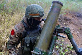 FILE PHOTO: A service member of pro-Russian troops fires a mortar in the direction of Avdiivka during Russia-Ukraine conflict, outside Donetsk, Ukraine September 17, 2022. REUTERS/Alexander Ermochenko  A service member of pro-Russian troops fires a mortar in the direction of Avdiivka during Russia-Ukraine conflict, outside Donetsk, Ukraine on Sept. 17. -  REUTERS/Alexander Ermochenko
