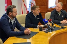 Newfoundland and Labrador Premier Andrew Furey, centre, announced $30 million in emergency funding for those affected by post tropical storm Fiona. With him are ministers Andrew Parsons and Elvis Loveless. - Keith Gosse