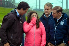 A distraught Amy Osmond describes the night hurricane Fiona destroyed her home to Prime Minister Justin Trudeau (left), MP Seamus O’Regan (second from right) and Premier Andrew Furey, in Port aux Basques Wednesday, Sept. 28. Keith Gosse • The Telegram