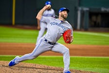 Sep 11, 2022; Arlington, Texas, USA; Toronto Blue Jays relief pitcher Anthony Bass (52) pitches against the Texas Rangers during the eighth inning at Globe Life Field.  