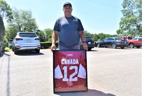 Gerald Marshall didn’t have a camera while in Moscow in 1972 for the final four games of the Summit Series between Canada and the Soviet Union, but he did take advantage of the opportunity to obtain the jersey worn by Montreal Canadiens’ star Yvan Cournoyer who was a standout throughout the series for Canada. He is pictured at Abercrombie Golf Club where he works as a groundskeeper. Richard MacKenzie