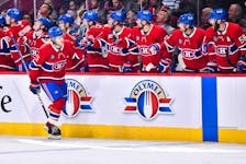 Kaiden Guhle of the Montreal Canadiens celebrates his goal with teammates on the bench against the Winnipeg Jets during the first period at Centre Bell on Thursday, Sept. 29, 2022 in Montreal.