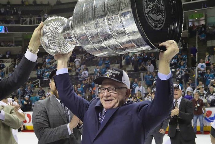  Jim Rutherford hoists the Stanley Cup after his Pittsburgh Penguins won the first of their two straight Cups in June 2016 over the San Jose Sharks in San Jose, Calif.