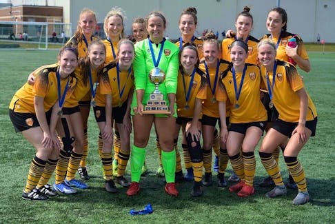 Halifax County United players proudly display the championship trophy after winning the Nova Scotia Soccer League's senior women AAA title.