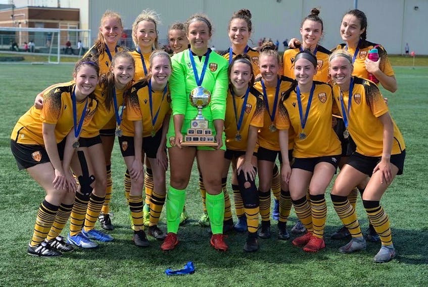 Halifax County United players proudly display the championship trophy after winning the Nova Scotia Soccer League's senior women AAA title.