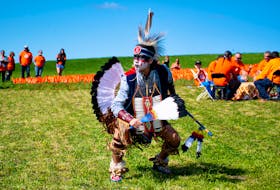 Brady Googoo, from Millbrook First Nation, performs a men's traditional dance on the grounds of the former Shubenacadie Indian Residential School on Friday, Sept. 30, 2022. Hundreds of people took part in a ceremony marking Truth and Reconciliation Day on Friday.