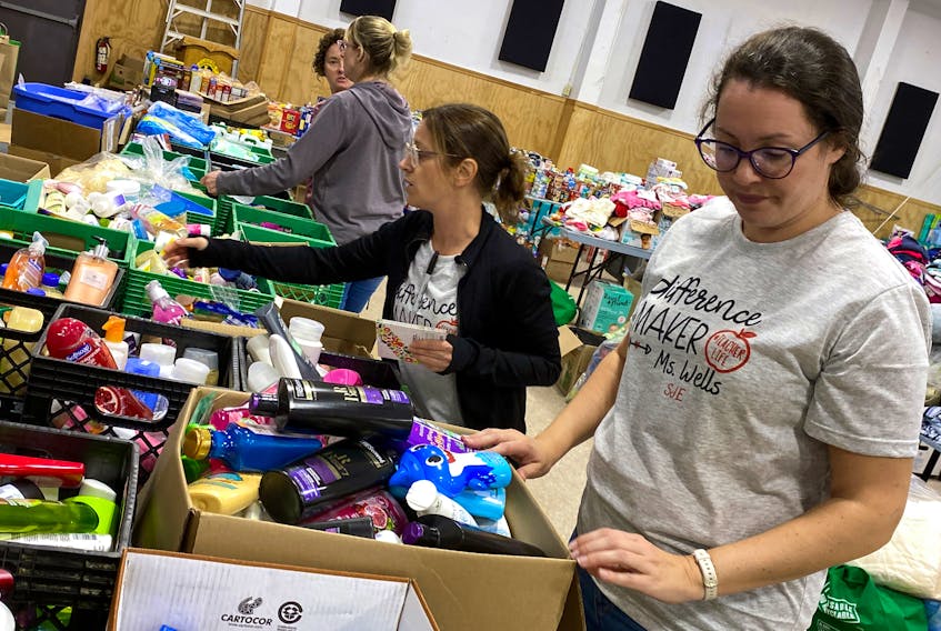 Volunteers Holly Wells(right) and Robin O'Quinn look through donations at the Port Aux Basques Lions Club after hurricane Fiona struck the town and other communities on the south coast.


Keith Gosse/The Telegram