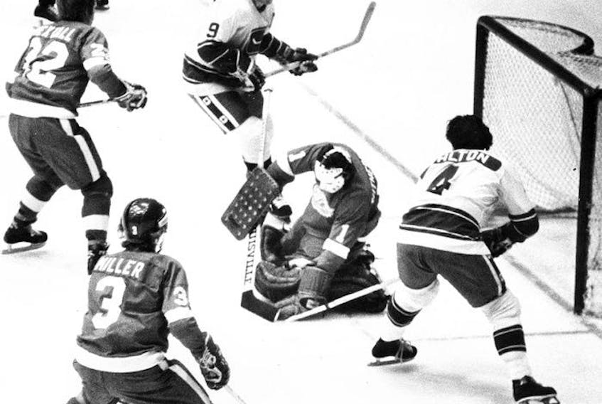  Long before he became an accomplished NHL executive, Jim Rutherford was a goalie for the Detroit Red Wings, here stopping Mike Walton, right, and fellow Vancouver Canuck Don Lever, top, in an October 1977 NHL game at the Pacific Coliseum.