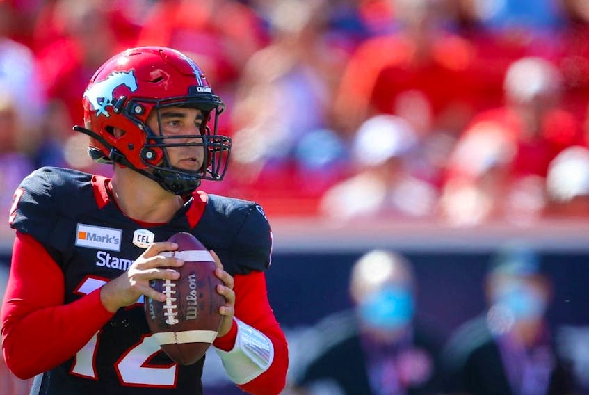 Calgary Stampeders quarterback Jake Maier looks for an open receiver against the Edmonton Elks during CFL football in Calgary on Sept. 6, 2021.