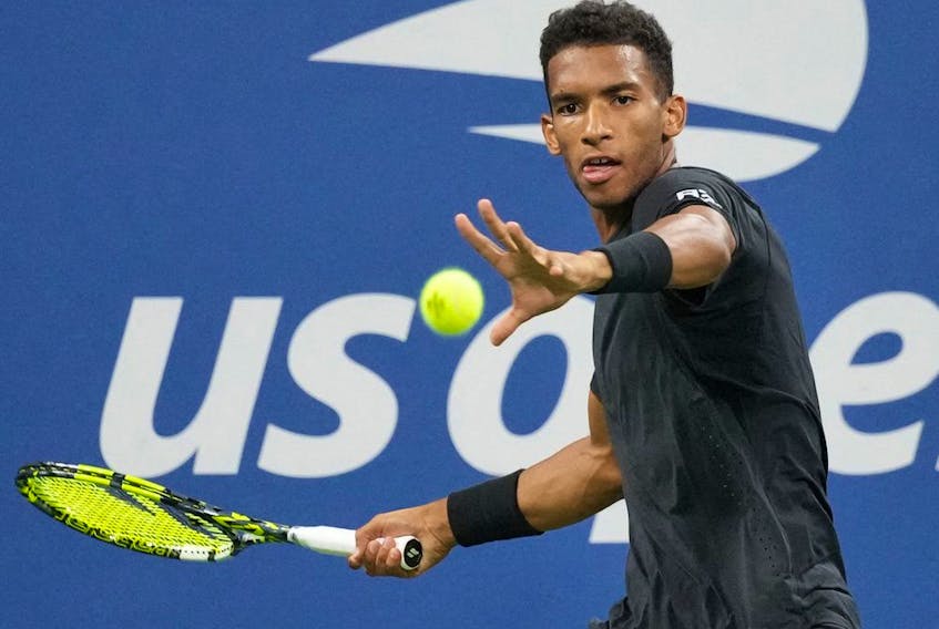  Felix Auger-Aliassime of Canada hits a shot against Jack Draper of Great Britain on Day 3 of the 2022 U.S. Open tennis tournament at USTA Billie Jean King Tennis Center in New York on Aug. 31, 2022.