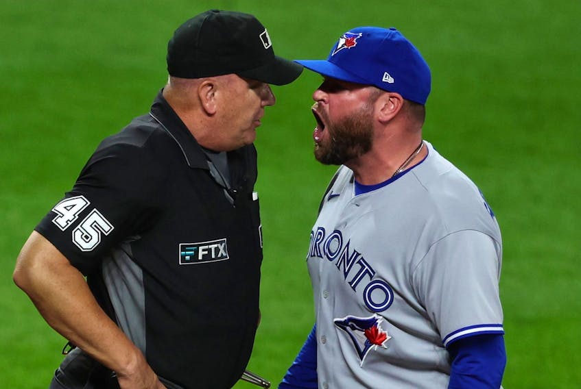 Manager John Schneider of the Toronto Blue Jays yells at umpire Jeff Nelson after being ejected against the Baltimore Orioles.