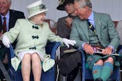 BRAEMAR, SCOTLAND - SEPTEMBER 04:  Queen Elizabeth II and Prince Charles, Prince of Wales laugh as they watch the tug-of-war during the Braemar Highland Games at The Princess Royal and Duke of Fife Memorial Park on September 4, 2010 in Braemar, Scotland. The Braemar Gathering is the most famous of the Highland Games and is known worldwide. Each year thousands of visitors descend on this small Scottish village on the first Saturday in September to watch one of the more colourful Scottish traditions. The Gathering has a long history and in its modern form it stretches back nearly 200 years.  (Photo by Chris Jackson/Getty Images)