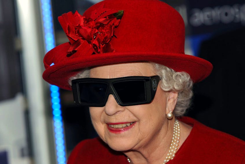 SHEFFIELD, ENGLAND - NOVEMBER 18: Queen Elizabeth II  wears 3 D glasses to watch a display and pilot a JCB digger, during a visit to the University of Sheffield Advanced Manufacturing Research centre, on November 18, 2010 in Sheffield, England. (Photo by John Giles - WPA Pool/Getty Images)