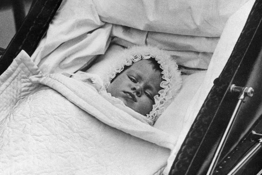 Britain's Princess Elizabeth is pictured in her baby carriage for her first outing on October 9, 1926. (Photo by - / various sources / AFP) / France ONLY (Photo by -/INTERNATIONAL NEWS PHOTOS (INP)/AFP via Getty Images)