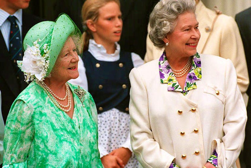 The Queen Mother (L) is joined by her eldest daughter, Queen Elizabeth II outside Clarence House 04 August 1993 on her 93rd birthday. The Queen Mother is the widow of Britain's wartime monarch, King George VI. (Photo credit should read EPA/AFP via Getty Images)