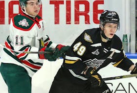 Cape Breton Eagles centre Ivan Ivan, right, fends off Halifax Mooseheads left winger Jordan Dumain during their New Year's Eve afternoon game at Centre 200 on Saturday. The Eagles lost 11-3. CONTRIBUTED
