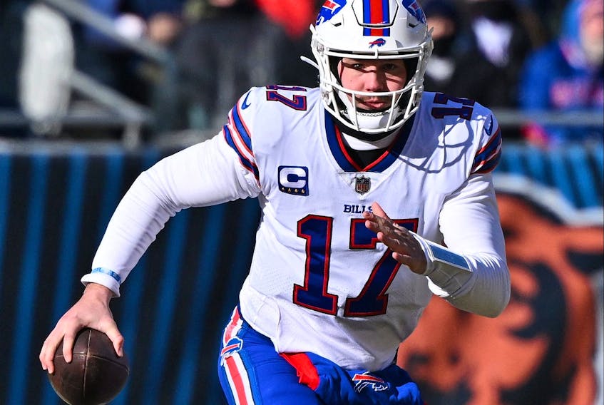 Buffalo Bills quarterback Josh Allen runs out of the pocket in the first half against the Chicago Bears at Soldier Field in Chicago, Dec. 24, 2022.