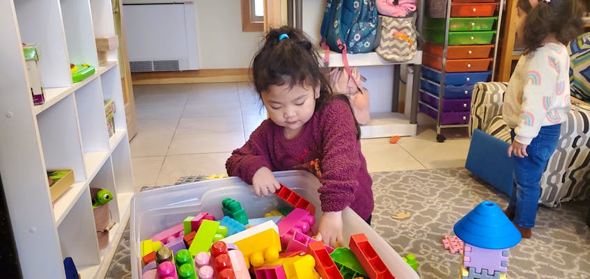 Little Yzabela Buan plays with toy blocks while in the care of the Sisters of the Sacred Heart of Jesus. Colin MacLean