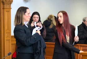 Teacher Krysta Grimes (right) prepares to leave a St. John's courtroom with her lawyer, Rosellen Sullivan, after the first day of her trial Wednesday, Jan. 11.