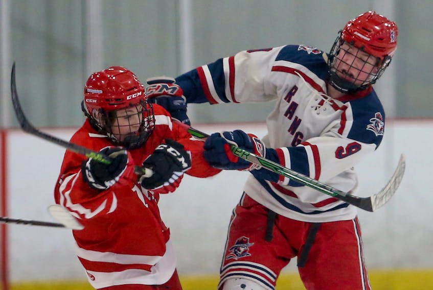 Truro Bearcats' Henry Thorne, left, collides with Rangers' Landon O'Grady during Under-15 Major action on the opening day of the Saltwire East Coast Ice Jam hockey tournament  in Bedford on Wednesday.