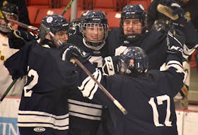 Members of the Sydney Academy Wildcats celebrate after Keagan Corbett scored the team’s second goal of the game at the Blue and White Contractor Cup action at the Membertou Sport and Wellness Centre on Thursday. JEREMY FRASER/CAPE BRETON POST.