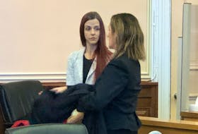 St. Joihn's teacher Krysta Grimes speaks with her lawyer, Rosellen Sullivan, following the second day of her sexual exploitation trial in Newfoundland and Labrador Supreme Court in St. John's Thursday, Jan. 12, 2023.
