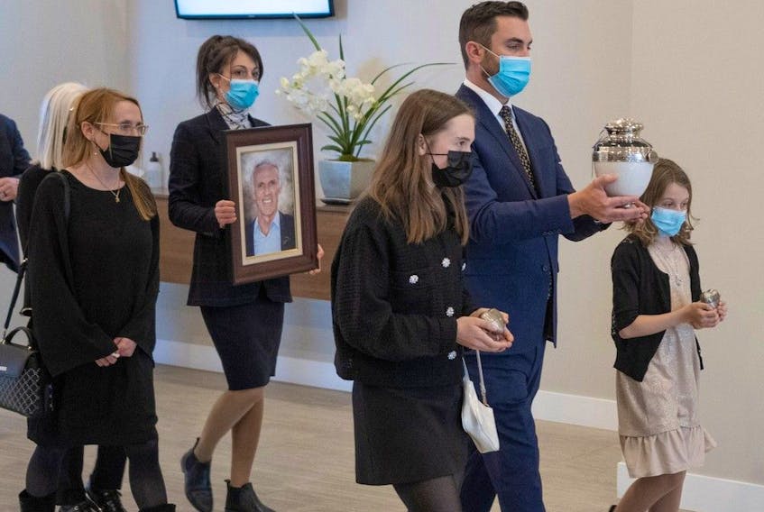  Family members follow the urn of New York Islanders Hockey Hall of Famer Mike Bossy during funeral services in Ste-Thérèse on April 28, 2022.