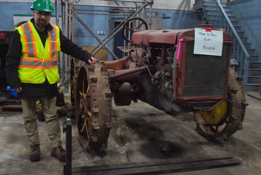 Craig MacDonald, manager of the Museum of Industry, said it takes a lot of preparation and logistics to determine which artifacts go where from storage. This tractor will make its way to Ross Farm.