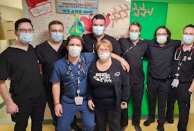 Mona Molloy, a charge nurse at the Health Sciences Centre in St. John’s, is surrounded by her colleagues. On Jan. 11, the general surgery ward called 4 North B had an all-male crew of registered nurses on the floor. It's the first time it's ever happened. - Contributed