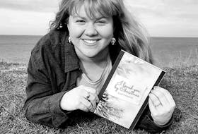 Alex Cormier of Sydney Mines is pictured with her recent release, "I loved you by Christmas." CONTRIBUTED