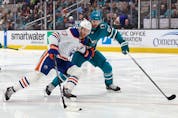 Sharks defenceman Erik Karlsson, right, a former Senators captain, checks Oilers star Connor McDavid in the first period of a game at San Jose on Friday.