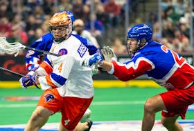 Halifax Thunderbirds defenceman Graeme Hossack is closely checked by Brad Kri of the Toronto Rock during National Lacrosse League action Saturday evening in Hamilton, Ont. - NATIONAL LACROSSE LEAGUE